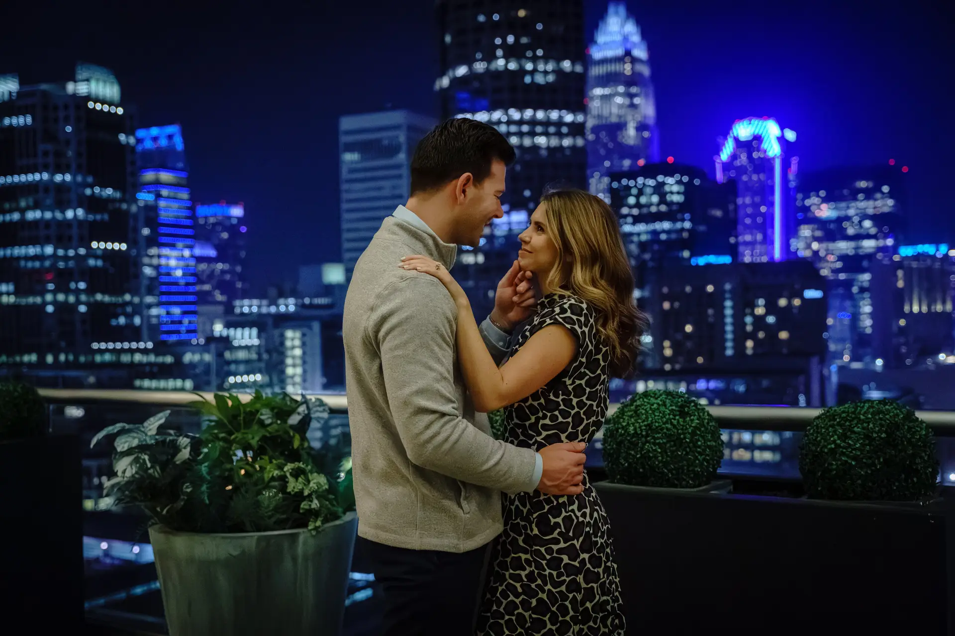 A newly engaged couple gaze at each other after a marriage proposal as photographed by Charlotte engagement photographer Claudia Wolff
